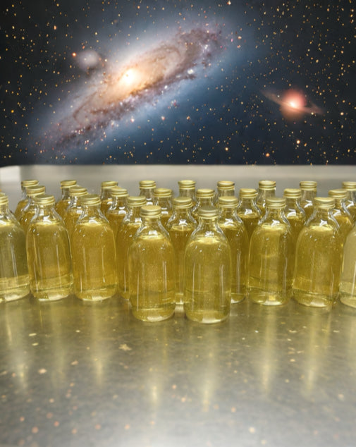 Group of 30cl toffee vodka bottles with space backdrop